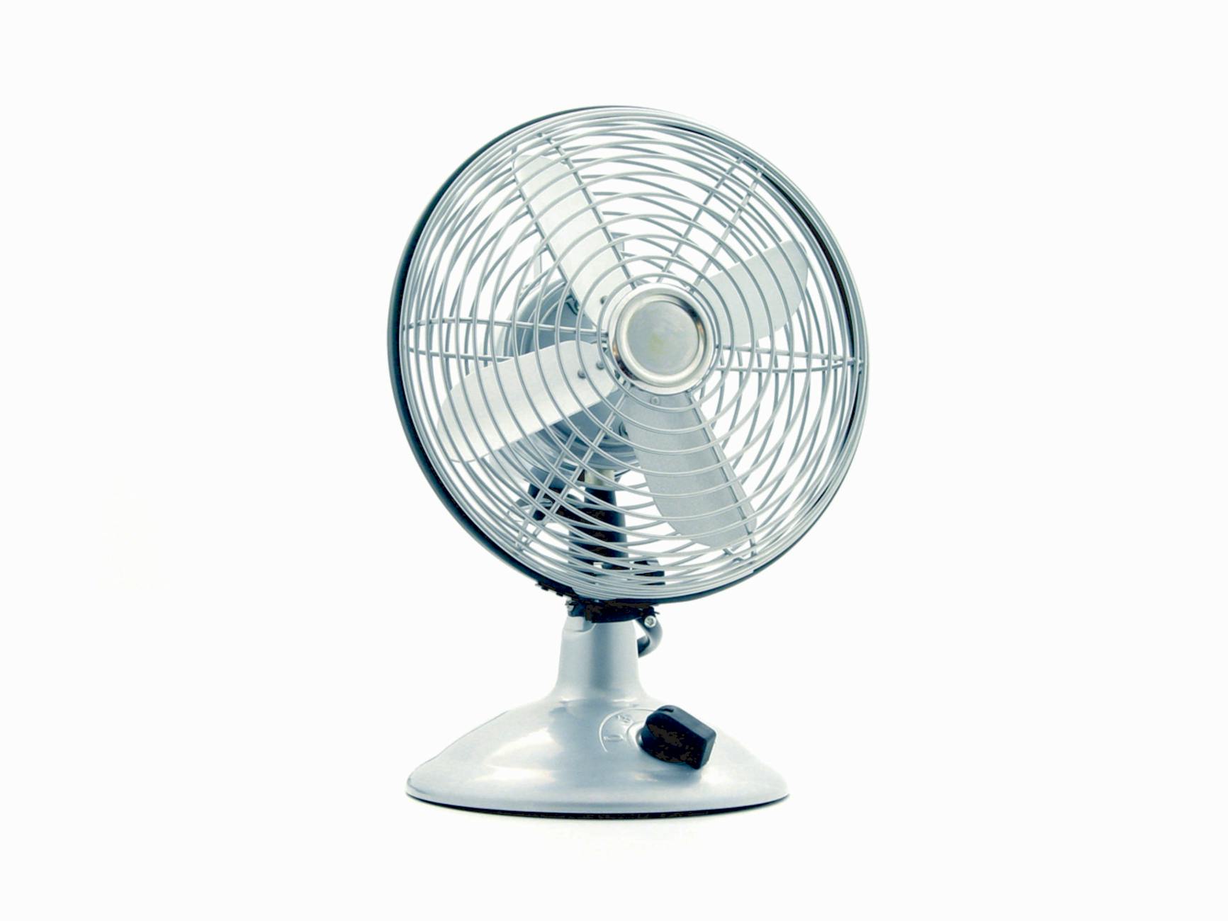 white desk fan on white table