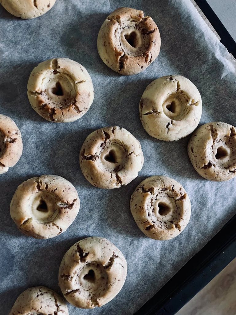 homemade heart shaped thumbprint cookies on tray