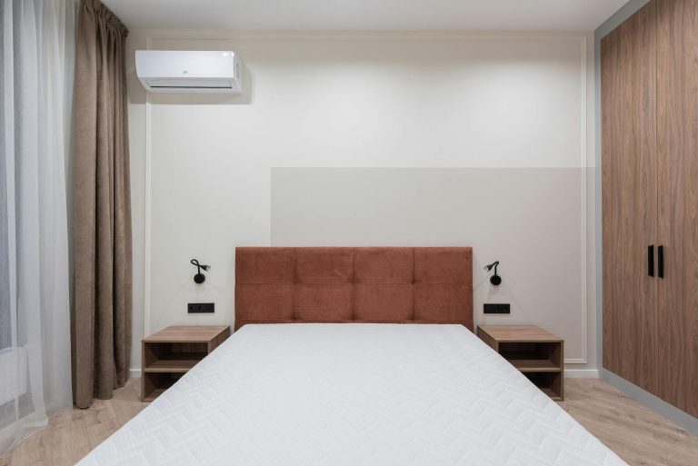 interior of bedroom with big bed and wardrobe